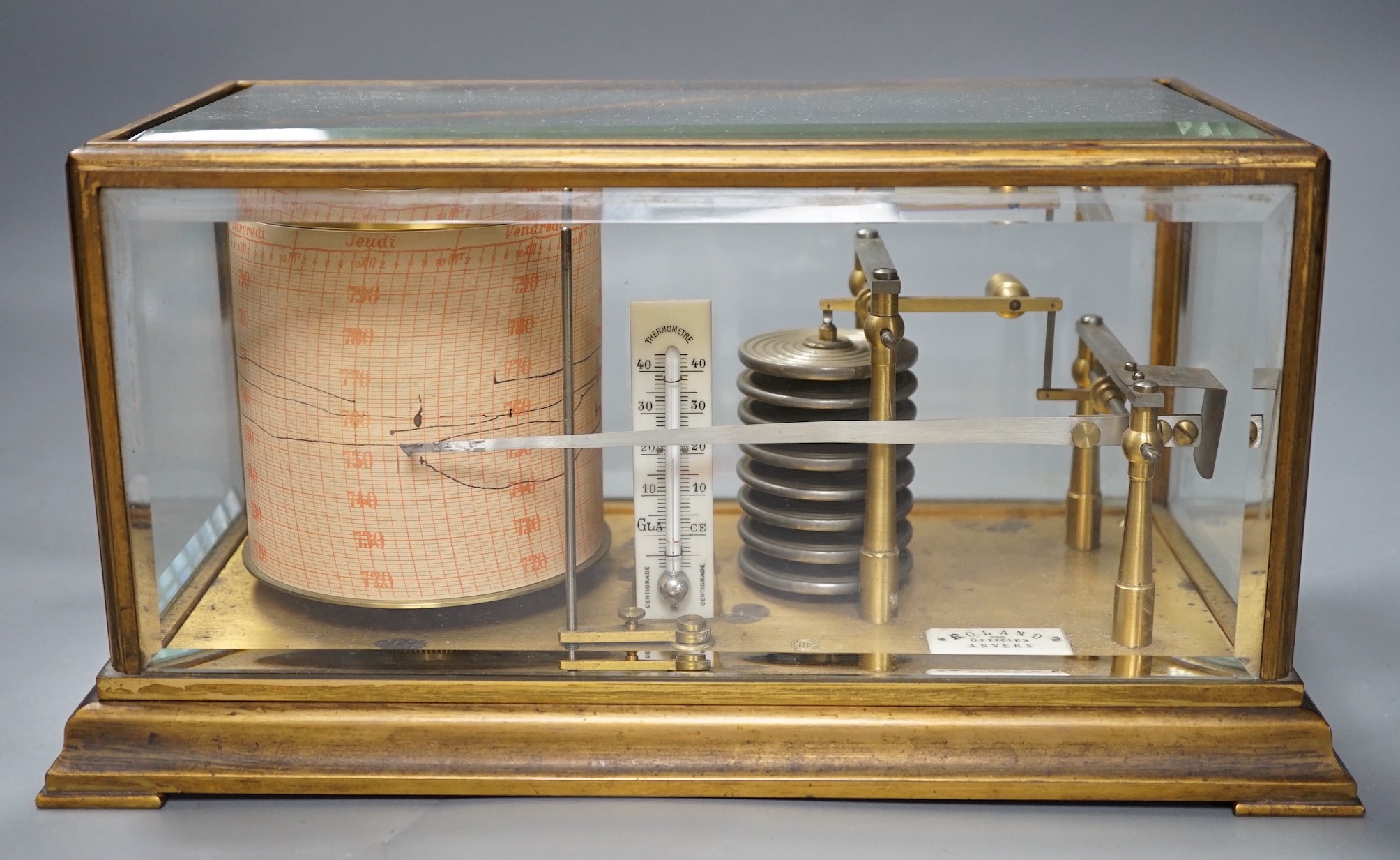 A French brass cased barograph, early 20th century, retailed by Roland, Anvers, number 65830, with ivory thermometer scale and retailers plaque, 30 cm wide